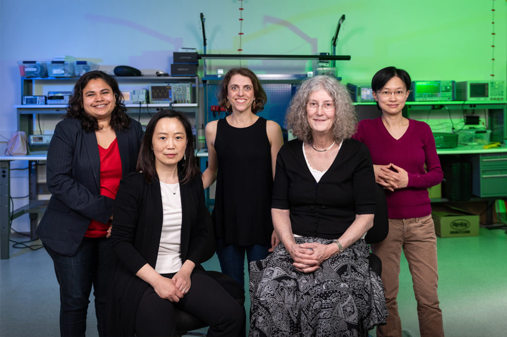 Five women faculty in a lab